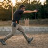 Shooter performing dynamic movement training indoors