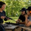 Instructor teaching shooting safety indoors