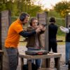 Beginners practicing at indoor shooting range