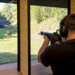 Shooter aiming in indoor shooting range