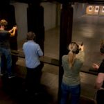 Adults shooting safely in indoor range
