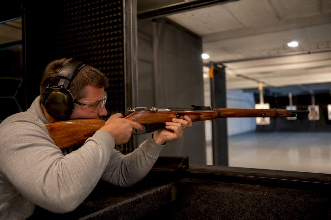 Shooter establishing cheek weld with Mosin Nagant