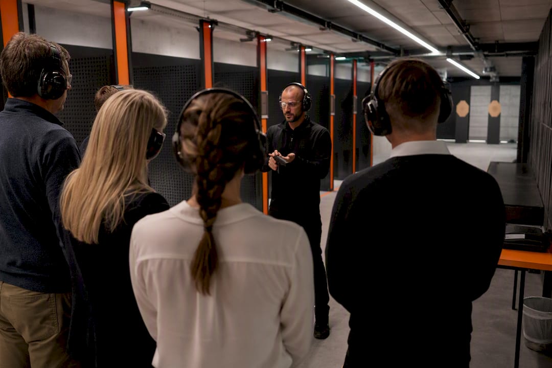 Instructor giving safety briefing indoors