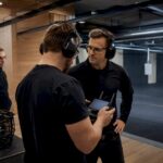 Instructor supervising indoor FPV security training