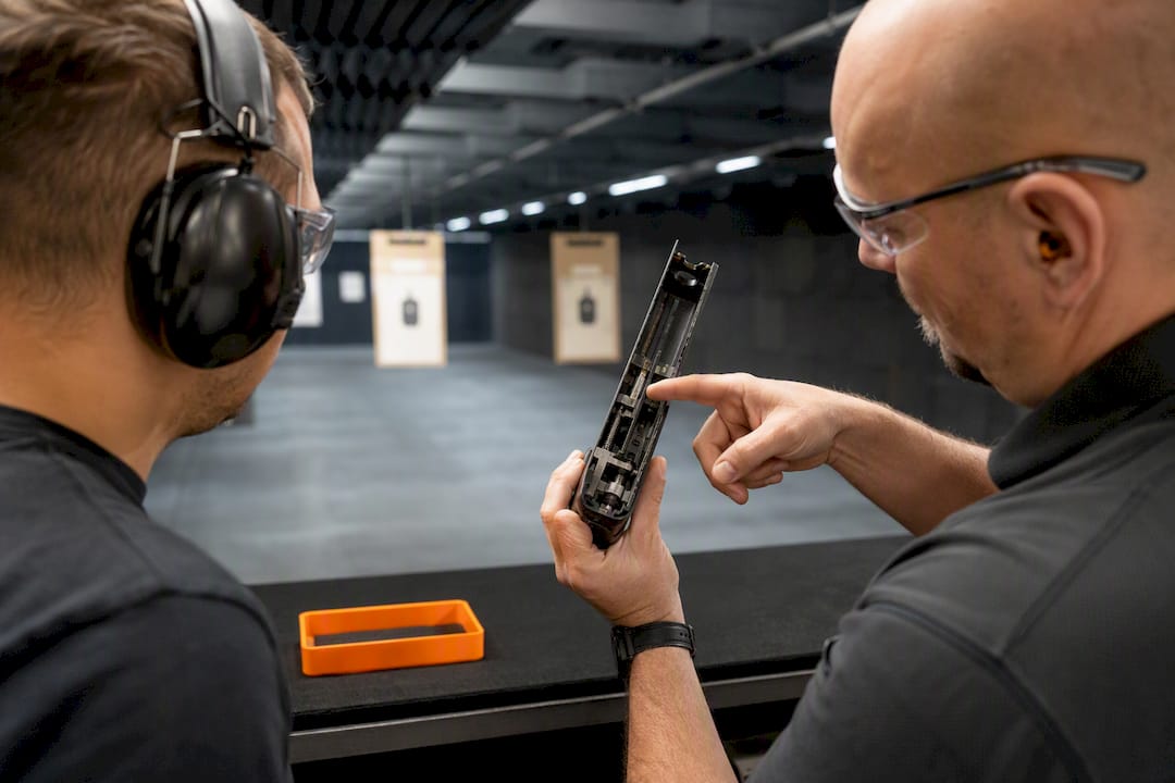 Instructor explaining firearm action mechanism