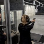 Instructor observing safe firearm handling at an indoor range
